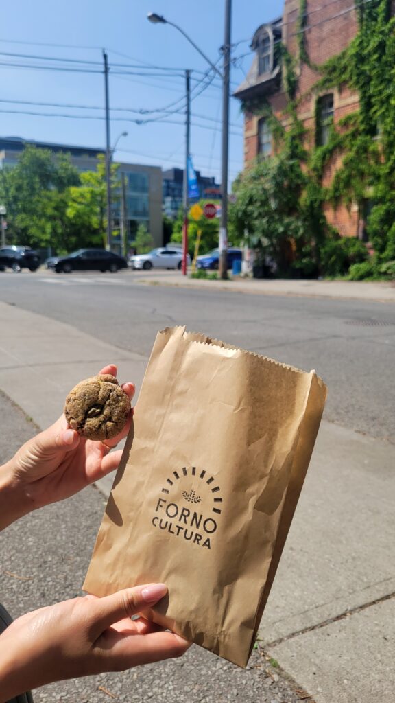 Forno Cultura on Queen | Pistachio cookie beside a Forno Cultura bag | Homes Almanac