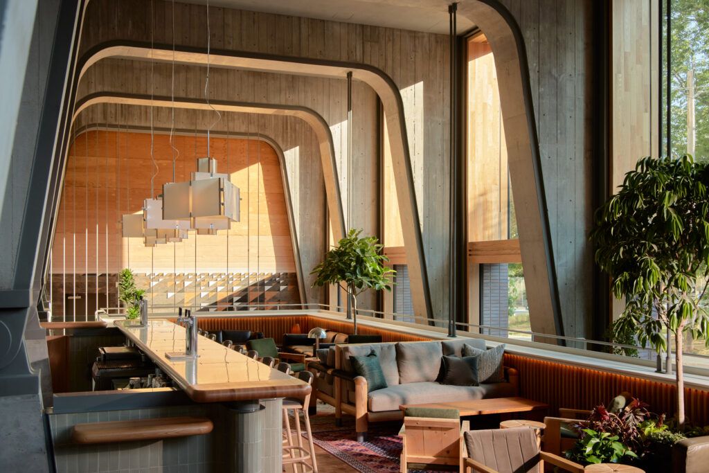 Ace Hotel Toronto | Interior view of Ace Hotel lobby in Toronto showcasing Douglas fir detailing, deep leather seating, and ambient lighting | Homes Almanac