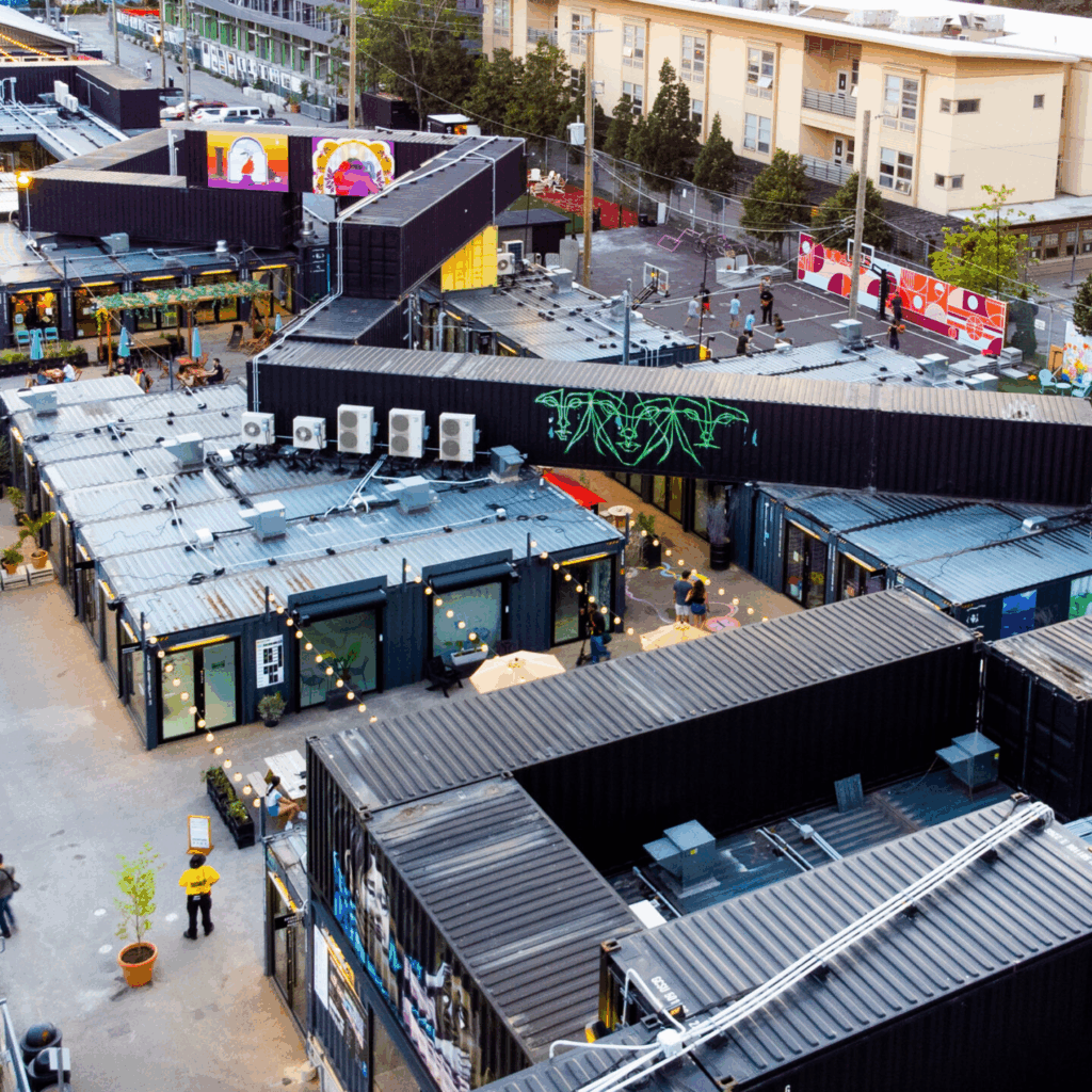Stackt Market Toronto | Aerial view of Stackt Market showcasing the geometric arrangement of shipping containers and courtyards | Homes Almanac