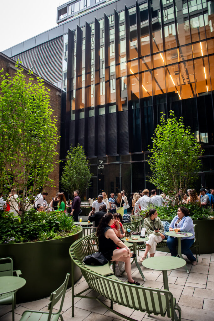 Civil Parks | Courtyard with lush greenery and people sitting and mingling | Homes Almanac