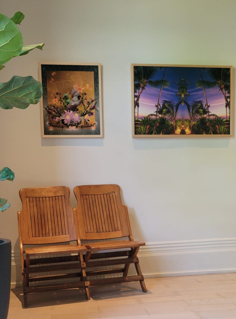 Art at Gladstone House | Two art pieces by Nika Belianina and Laura Kay Keeling hanging on a wall above two wooden chairs | Homes Almanac