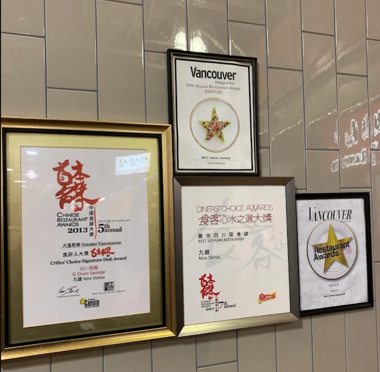 Nine Dumplings Vancouver | Various restaurant awards on display | Homes Almanac