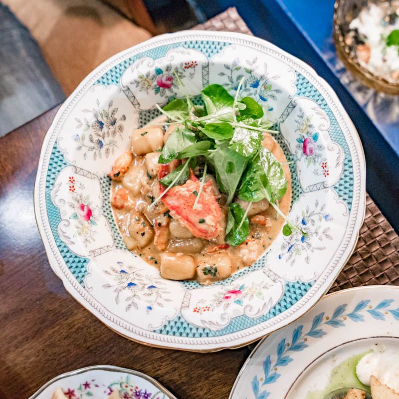 The Red Accordion Vancouver | Lobster gnocchi on a decorative plate | Homes Almanac