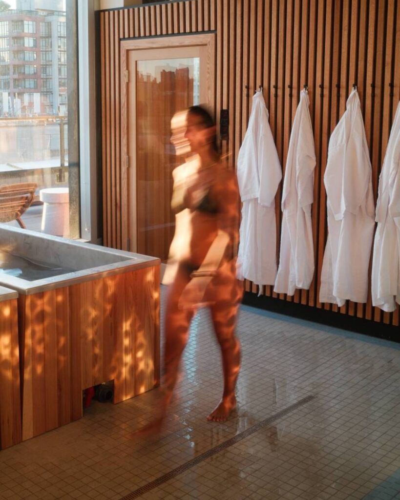 Tality Wellness | Woman walking through spa facilities | Homes Almanac