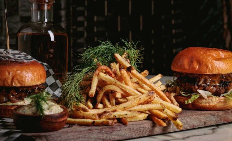 fermentation cocktails toronto | A heaping pile of french fries and a slider on either side | Homes Almanac