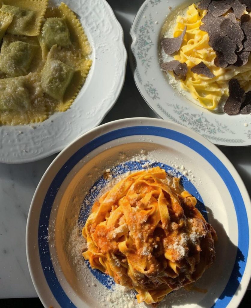 Geary Ave | Overhead shot of 3 types of pasta - ravioli, tagliatelle with truffle slices and tagliatelle with a red sauce | Homes Almanac