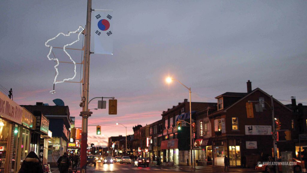 Koreatown Coffee guide | Evening street shot with a Korean flag banner hanging on street pole | Homes Almanac