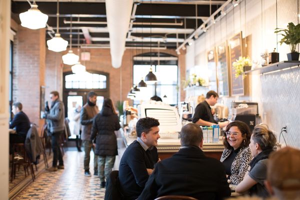 balzacs in liberty village | people sitting in a brightly lit coffee shop | Homes Almanac