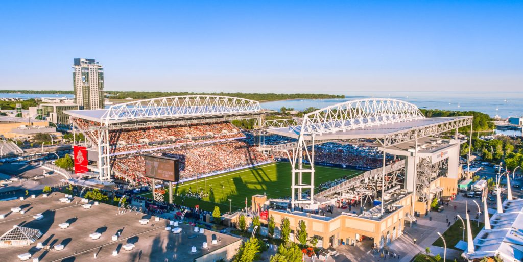 History of Liberty Village | Sunny day aerial shot of BMO Field with a full stadium | Homes Almanac
