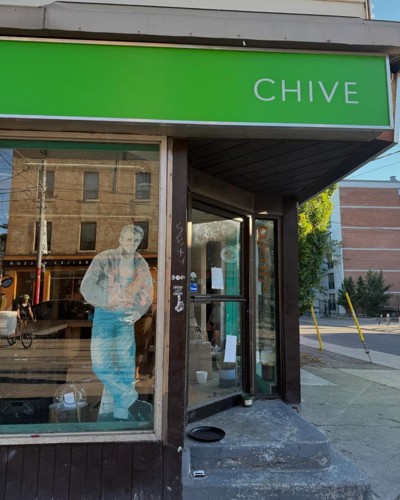chive toronto | floor to ceiling window with a green sign above the door that says "chive" | Homes Almanac