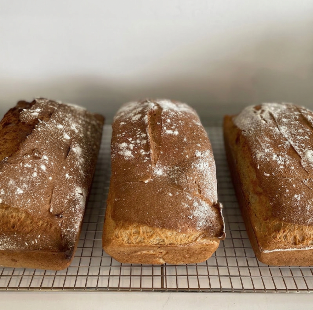 Vancouver gluten-free bakery | Three gluten-free loaves sitting on a wire cooling rack | Homes Almanac