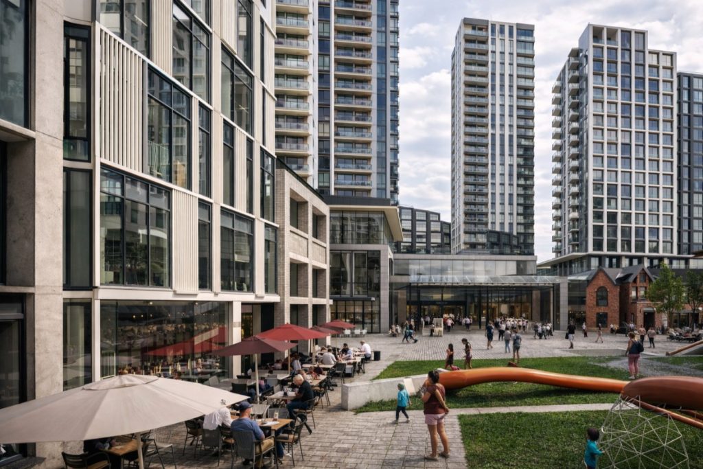 master-planned third places | 3D Rendering of Mirvish village's public space with park, outdoor seating, and people walking around | Homes Almanac